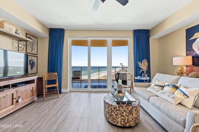 15928 Front Beach Rd Unit 3-2005, Panama City Beach, FL 32413 - living room featuring wood finished floors, plenty of natural light, ceiling fan, and a water view
