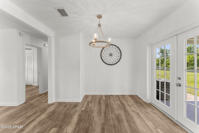 2020 Greenbriar Blvd, Lynn Haven, FL 32444 - unfurnished dining area featuring a chandelier and wood finished floors