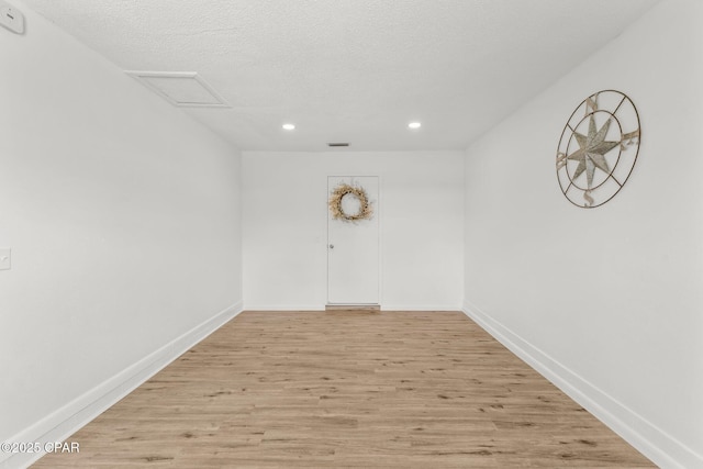 2020 Greenbriar Blvd, Lynn Haven, FL 32444 - spare room with recessed lighting, light wood finished floors, a textured ceiling, and attic access