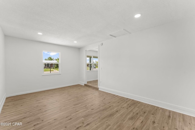 2020 Greenbriar Blvd, Lynn Haven, FL 32444 - unfurnished room featuring attic access, a textured ceiling, light wood-style floors, and recessed lighting