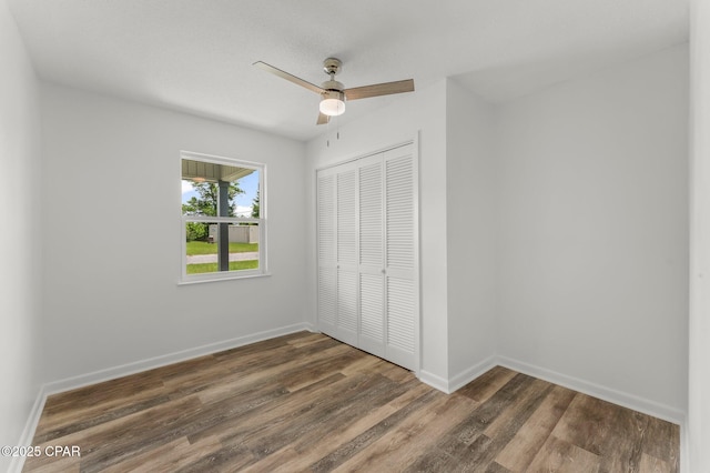 2020 Greenbriar Blvd, Lynn Haven, FL 32444 - unfurnished bedroom with a closet, dark wood finished floors, and ceiling fan