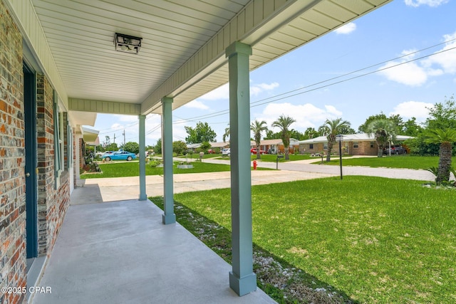 2020 Greenbriar Blvd, Lynn Haven, FL 32444 - covered porch with a yard and a residential view