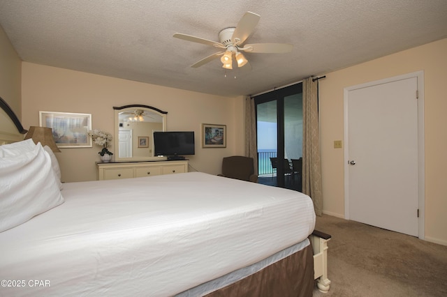 6201 Thomas Dr Unit 1005, Panama City Beach, FL 32408 - bedroom featuring carpet floors, ceiling fan, and a textured ceiling