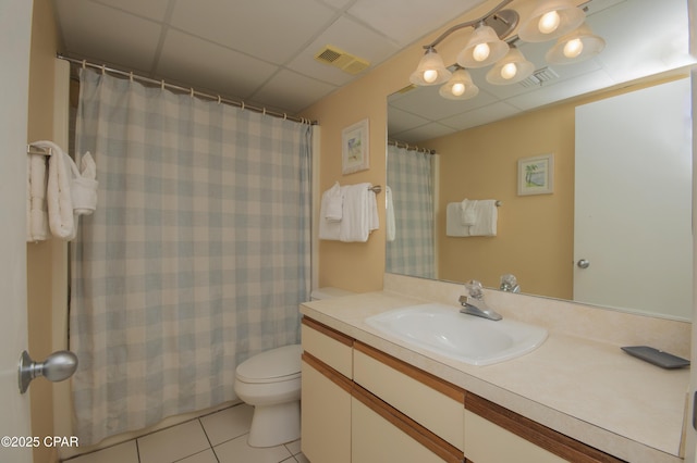 6201 Thomas Dr Unit 1005, Panama City Beach, FL 32408 - bathroom with vanity, tile patterned flooring, a paneled ceiling, and a shower with curtain