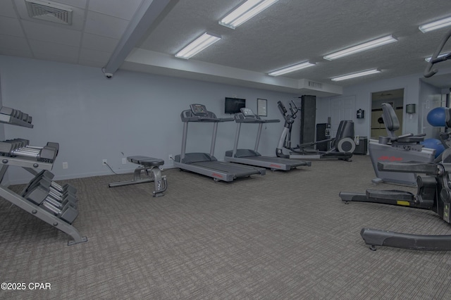 6201 Thomas Dr Unit 1005, Panama City Beach, FL 32408 - gym featuring carpet flooring and a textured ceiling