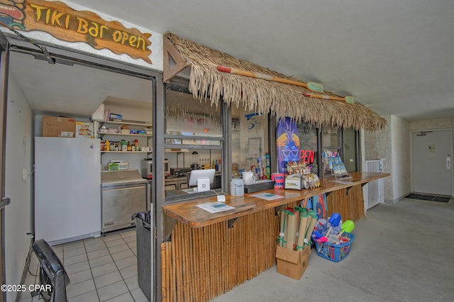 6201 Thomas Dr Unit 1005, Panama City Beach, FL 32408 - kitchen featuring freestanding refrigerator and refrigerator