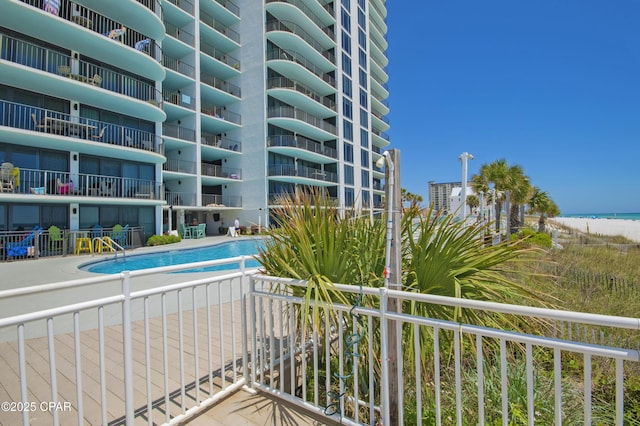 6201 Thomas Dr Unit 1005, Panama City Beach, FL 32408 - balcony with view of water and beach and view of pool