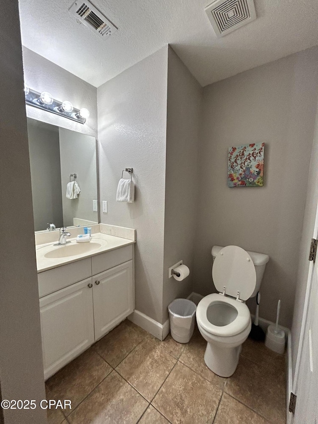 16819 Front Beach Rd Unit 107, Panama City Beach, FL 32413 - bathroom with vanity, tile patterned floors, and a textured ceiling