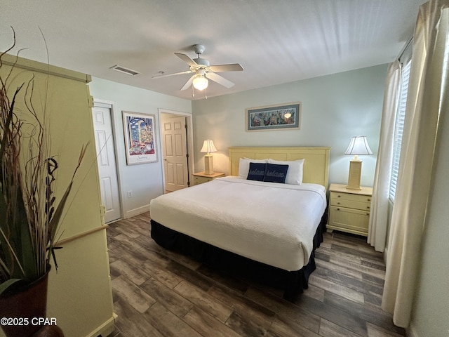 16819 Front Beach Rd Unit 107, Panama City Beach, FL 32413 - bedroom with dark wood-type flooring and ceiling fan