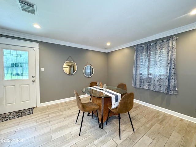 2816 N Panama Ave Unit A & B, Panama City, FL 32405 - dining area with light wood finished floors, crown molding, and recessed lighting