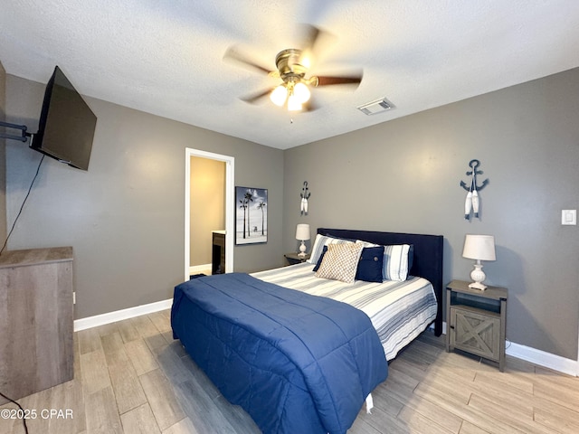 2816 N Panama Ave Unit A & B, Panama City, FL 32405 - bedroom featuring light wood-type flooring, ceiling fan, and a textured ceiling