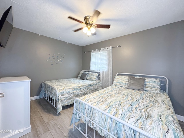 2816 N Panama Ave Unit A & B, Panama City, FL 32405 - bedroom featuring light wood-type flooring, a textured ceiling, and ceiling fan
