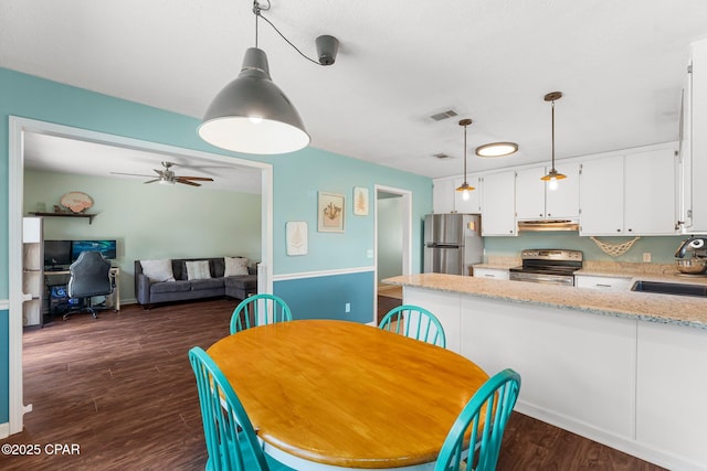 4004 E 7th Cir, Panama City, FL 32404 - dining space featuring dark wood-style flooring and ceiling fan