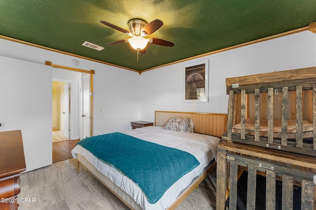 4004 E 7th Cir, Panama City, FL 32404 - bedroom with ornamental molding, ceiling fan, and wainscoting