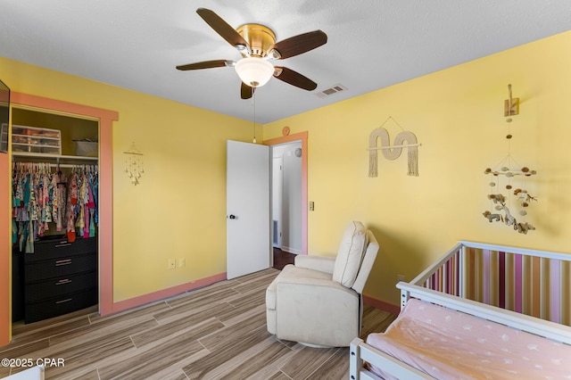 4004 E 7th Cir, Panama City, FL 32404 - bedroom with a closet, wood finished floors, and a ceiling fan