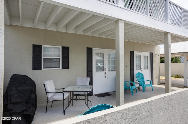 8410 Thomas Dr Unit 1, Panama City Beach, FL 32408 - view of patio / terrace featuring french doors