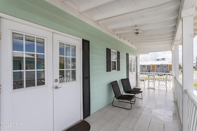 8410 Thomas Dr Unit 1, Panama City Beach, FL 32408 - covered porch with french doors