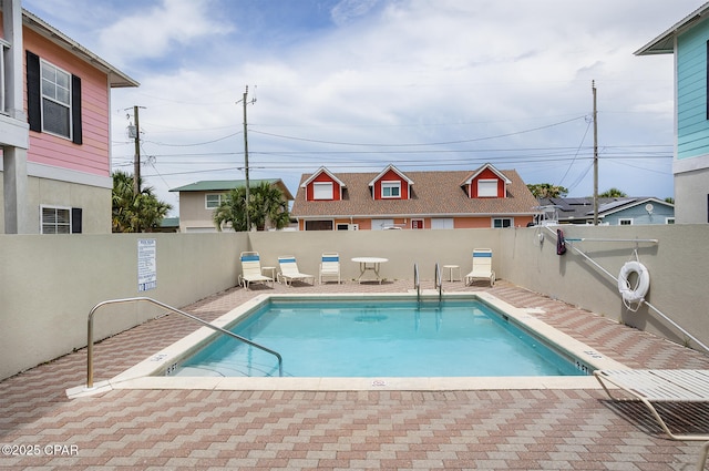 8410 Thomas Dr Unit 1, Panama City Beach, FL 32408 - community pool with a fenced backyard and a patio area