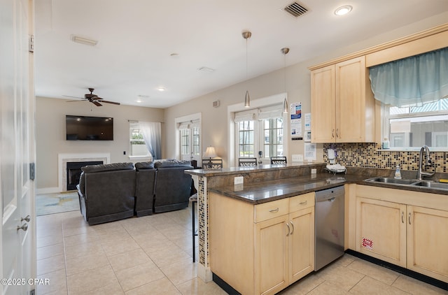 8410 Thomas Dr Unit 1, Panama City Beach, FL 32408 - kitchen with light brown cabinets, dishwasher, ceiling fan, a fireplace, and recessed lighting