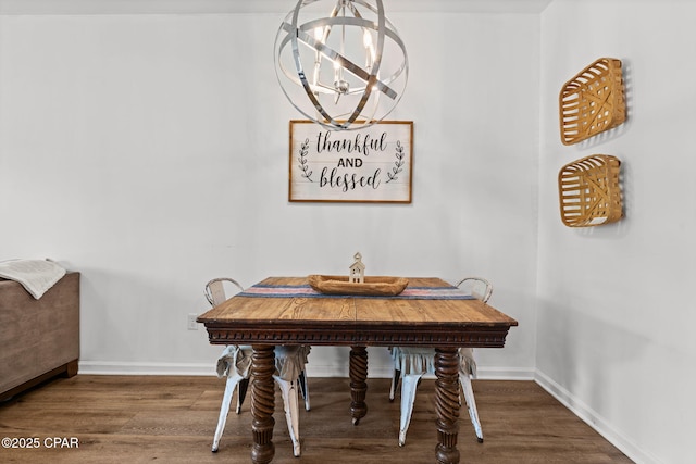 406 Raven Ln, Panama City, FL 32404 - dining space featuring a chandelier and wood finished floors