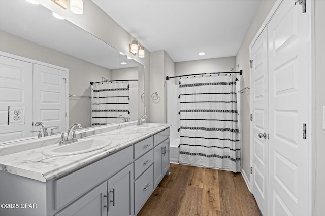 406 Raven Ln, Panama City, FL 32404 - bathroom featuring wood finished floors, double vanity, recessed lighting, and curtained shower