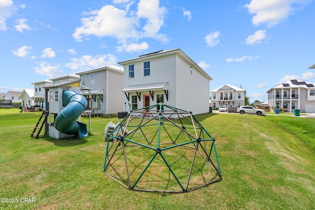 406 Raven Ln, Panama City, FL 32404 - back of property with a lawn, a playground, and a residential view