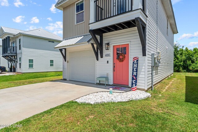 406 Raven Ln, Panama City, FL 32404 - entrance to property with a balcony, a lawn, driveway, board and batten siding, and an attached garage