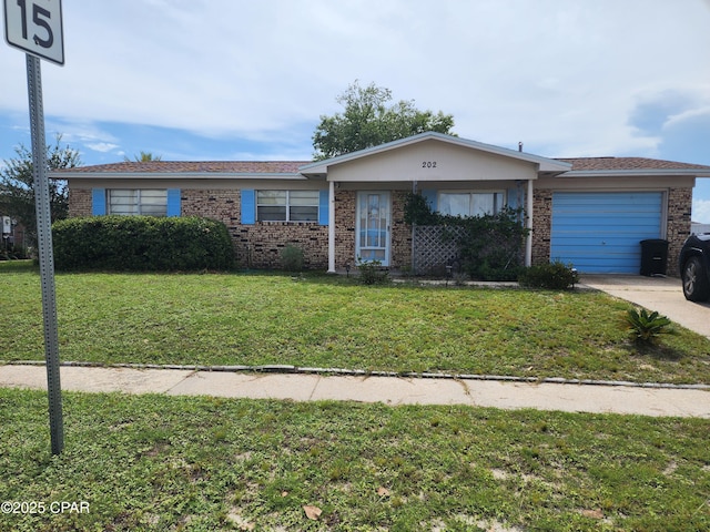 202 S Charlene Dr, Panama City, FL 32404 - ranch-style house featuring an attached garage, brick siding, concrete driveway, and a front yard