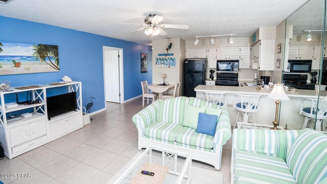 17670 Front Beach Rd Unit I4, Panama City Beach, FL 32413 - living room featuring rail lighting, light tile patterned floors, and ceiling fan