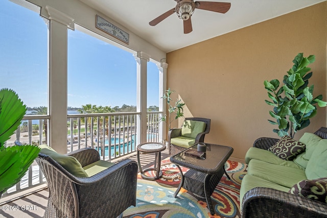 4100 Marriott Dr Unit 402, Panama City Beach, FL 32408 - balcony featuring a ceiling fan and view of pool area