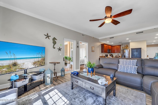 4100 Marriott Dr Unit 402, Panama City Beach, FL 32408 - living room featuring ornamental molding, a ceiling fan, light wood-style flooring, and recessed lighting