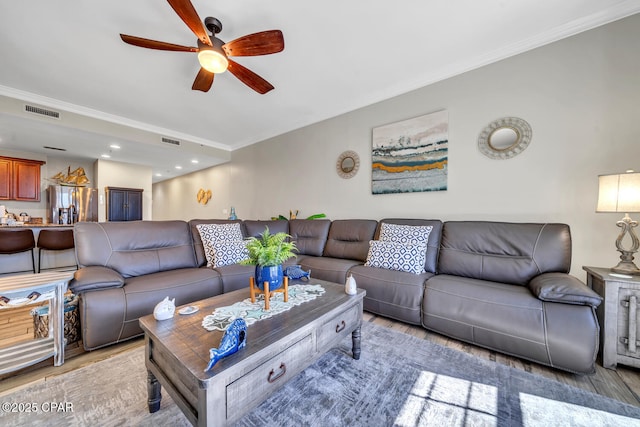 4100 Marriott Dr Unit 402, Panama City Beach, FL 32408 - living room with a ceiling fan, light wood-type flooring, and ornamental molding