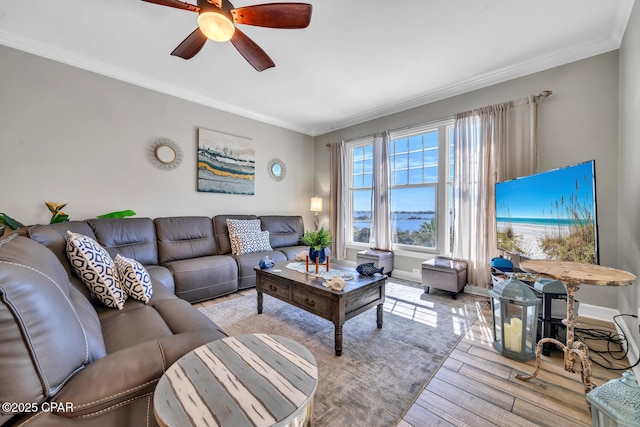 4100 Marriott Dr Unit 402, Panama City Beach, FL 32408 - living area featuring light wood-type flooring, ornamental molding, and a ceiling fan