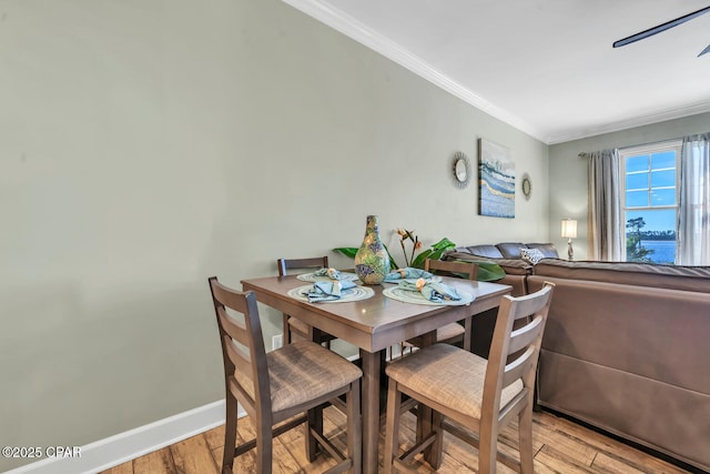 4100 Marriott Dr Unit 402, Panama City Beach, FL 32408 - dining space featuring ornamental molding and light wood-style floors