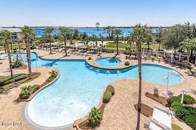 4100 Marriott Dr Unit 402, Panama City Beach, FL 32408 - community pool featuring a community hot tub and a patio area