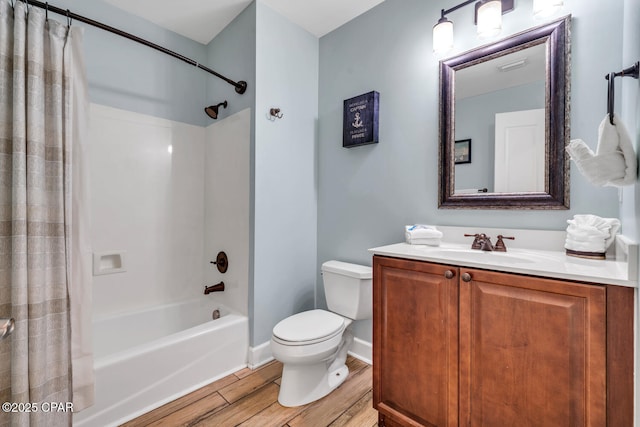 4100 Marriott Dr Unit 402, Panama City Beach, FL 32408 - full bathroom featuring shower / bath combo, wood finished floors, and vanity
