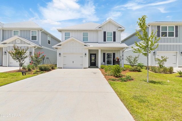 21818 Kelly Pines Pl, Panama City Beach, FL 32413 - view of front facade with board and batten siding, a garage, a front lawn, and driveway