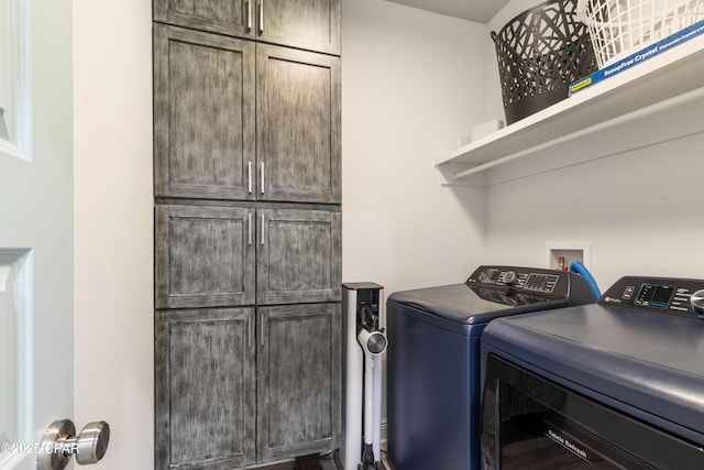 21818 Kelly Pines Pl, Panama City Beach, FL 32413 - washroom with washer and clothes dryer and cabinet space