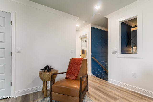 21818 Kelly Pines Pl, Panama City Beach, FL 32413 - sitting room with wood finished floors, recessed lighting, and an upstairs landing