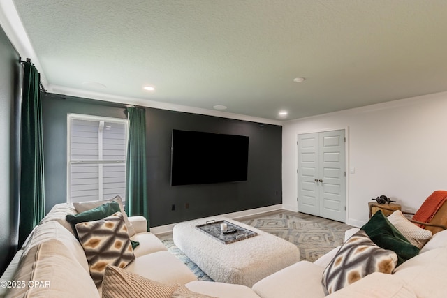 21818 Kelly Pines Pl, Panama City Beach, FL 32413 - living room featuring recessed lighting, crown molding, wood finished floors, and a textured ceiling