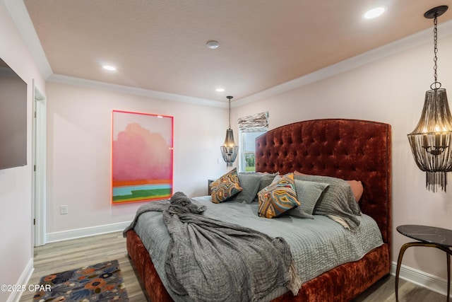 21818 Kelly Pines Pl, Panama City Beach, FL 32413 - bedroom with wood finished floors, recessed lighting, and crown molding