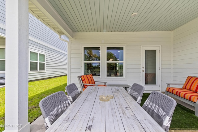 21818 Kelly Pines Pl, Panama City Beach, FL 32413 - wooden deck with outdoor dining space, a lawn, and outdoor lounge area
