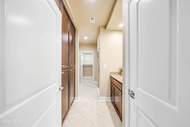 8700 Front Beach Rd Unit 7207, Panama City Beach, FL 32407 - bathroom with vanity, tile patterned floors, a walk in closet, and recessed lighting