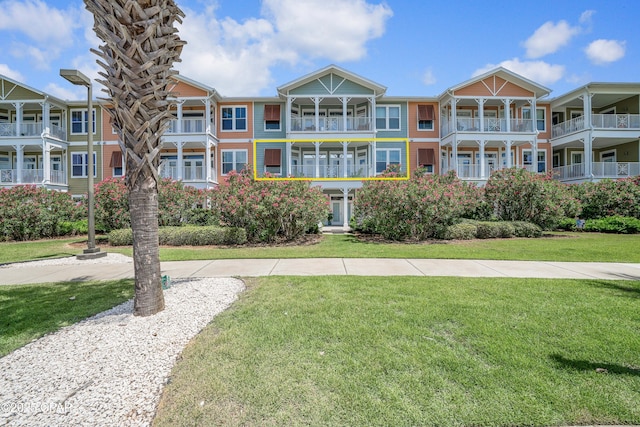 8700 Front Beach Rd Unit 7207, Panama City Beach, FL 32407 - view of front of home featuring a front lawn