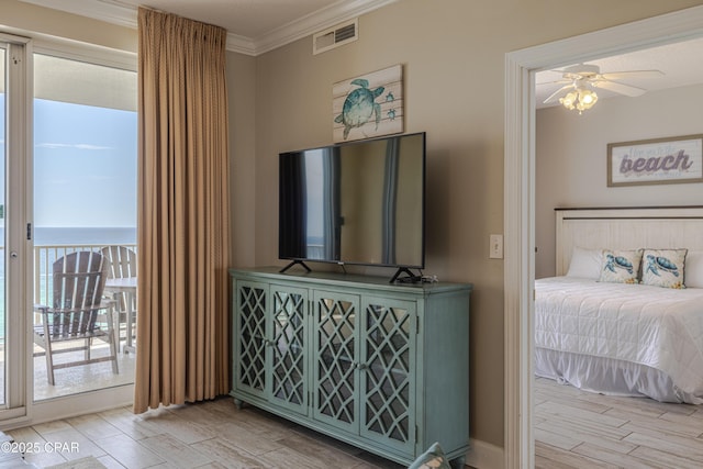 10625 Front Beach Rd Unit 1102, Panama City Beach, FL 32407 - bedroom with crown molding, access to exterior, and wood finished floors