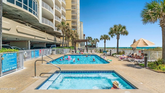 10625 Front Beach Rd Unit 1102, Panama City Beach, FL 32407 - community pool with a hot tub and a patio area