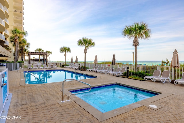 10625 Front Beach Rd Unit 1102, Panama City Beach, FL 32407 - community pool with a patio, a pergola, and a water view
