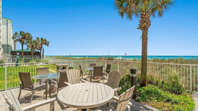 10625 Front Beach Rd Unit 1102, Panama City Beach, FL 32407 - view of patio with outdoor dining area and view of water and beach
