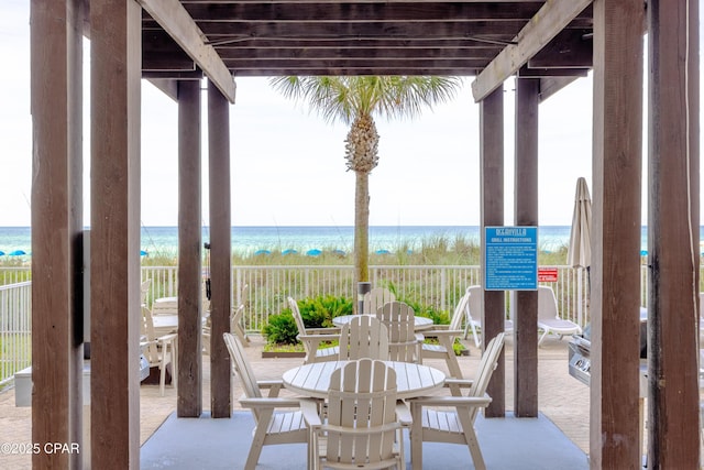 10625 Front Beach Rd Unit 1102, Panama City Beach, FL 32407 - view of patio featuring view of water and beach and outdoor dining space