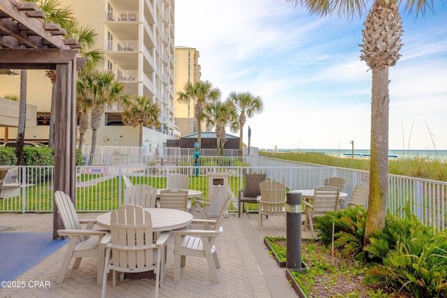 10625 Front Beach Rd Unit 1102, Panama City Beach, FL 32407 - view of patio / terrace featuring outdoor dining area and a water view